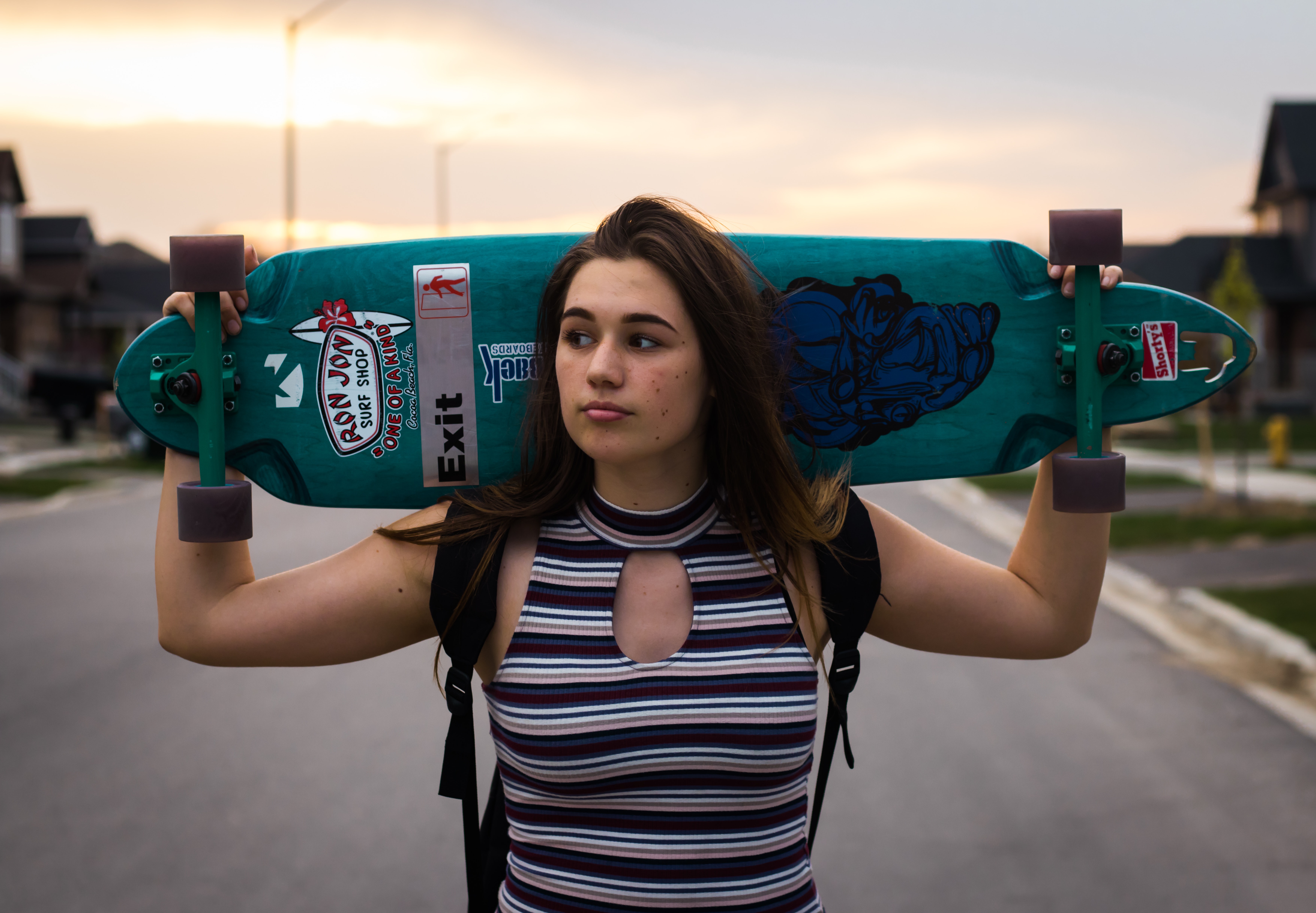 woman with board on shoulders