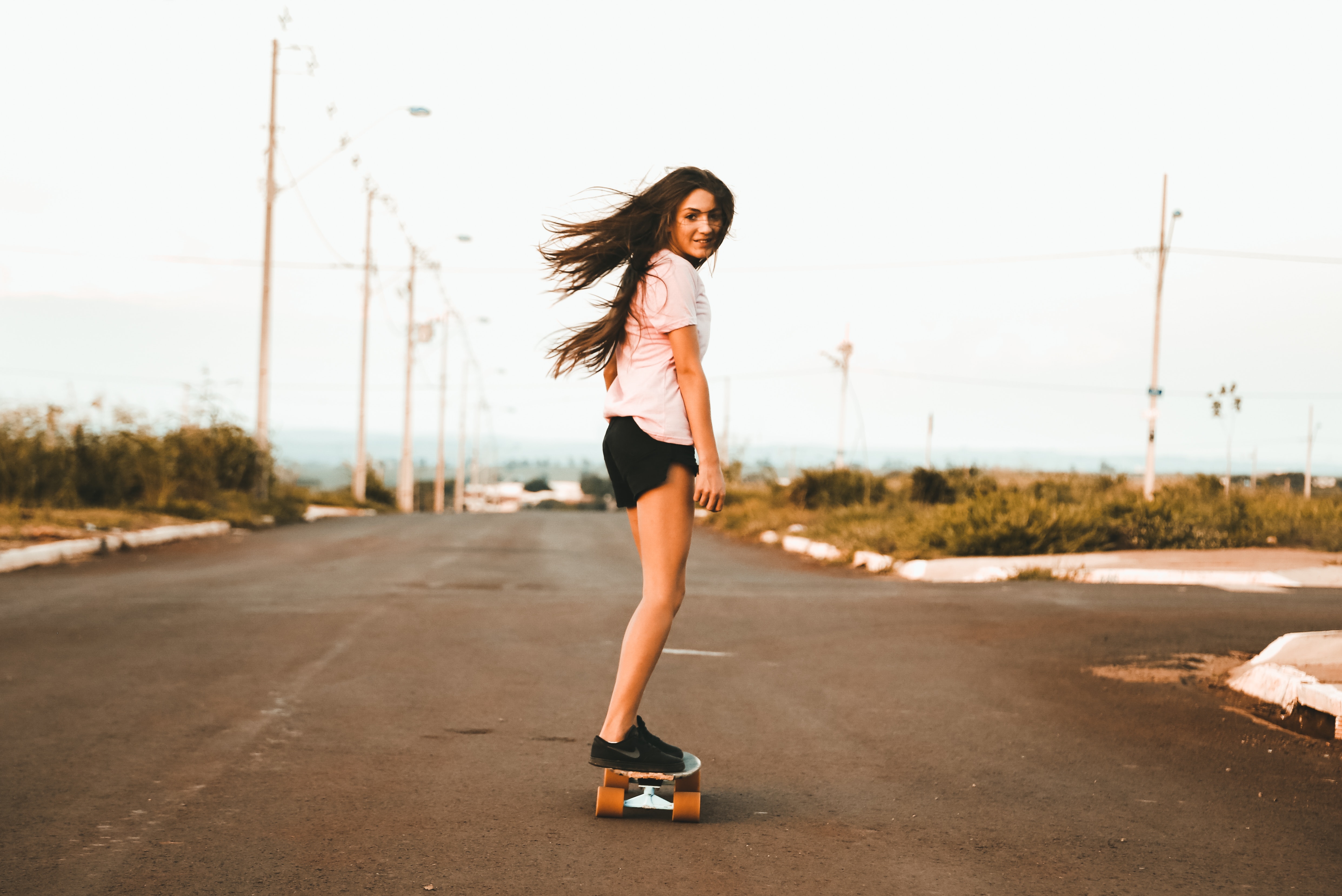 woman skateboarding towards camera