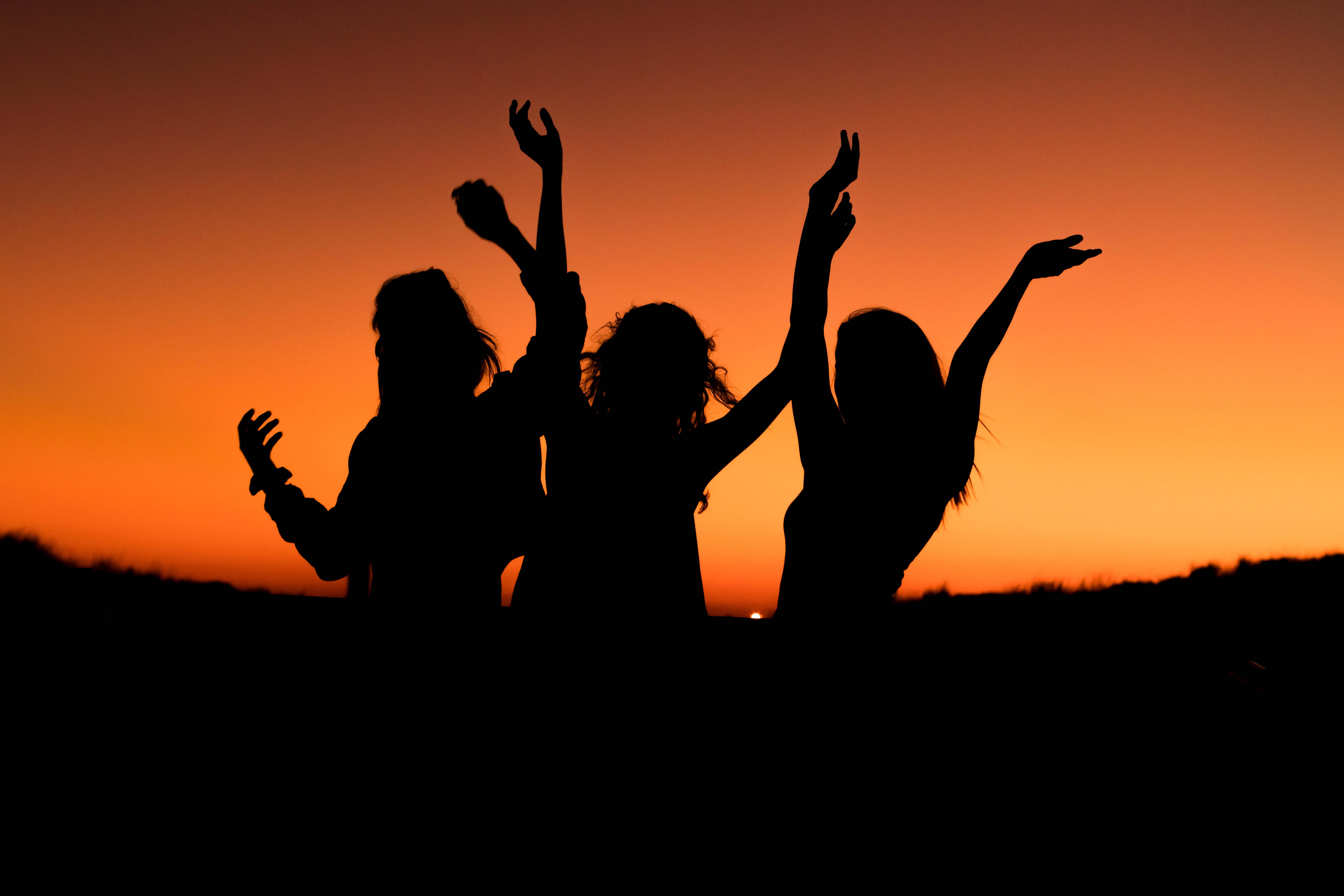 silhouette of three women