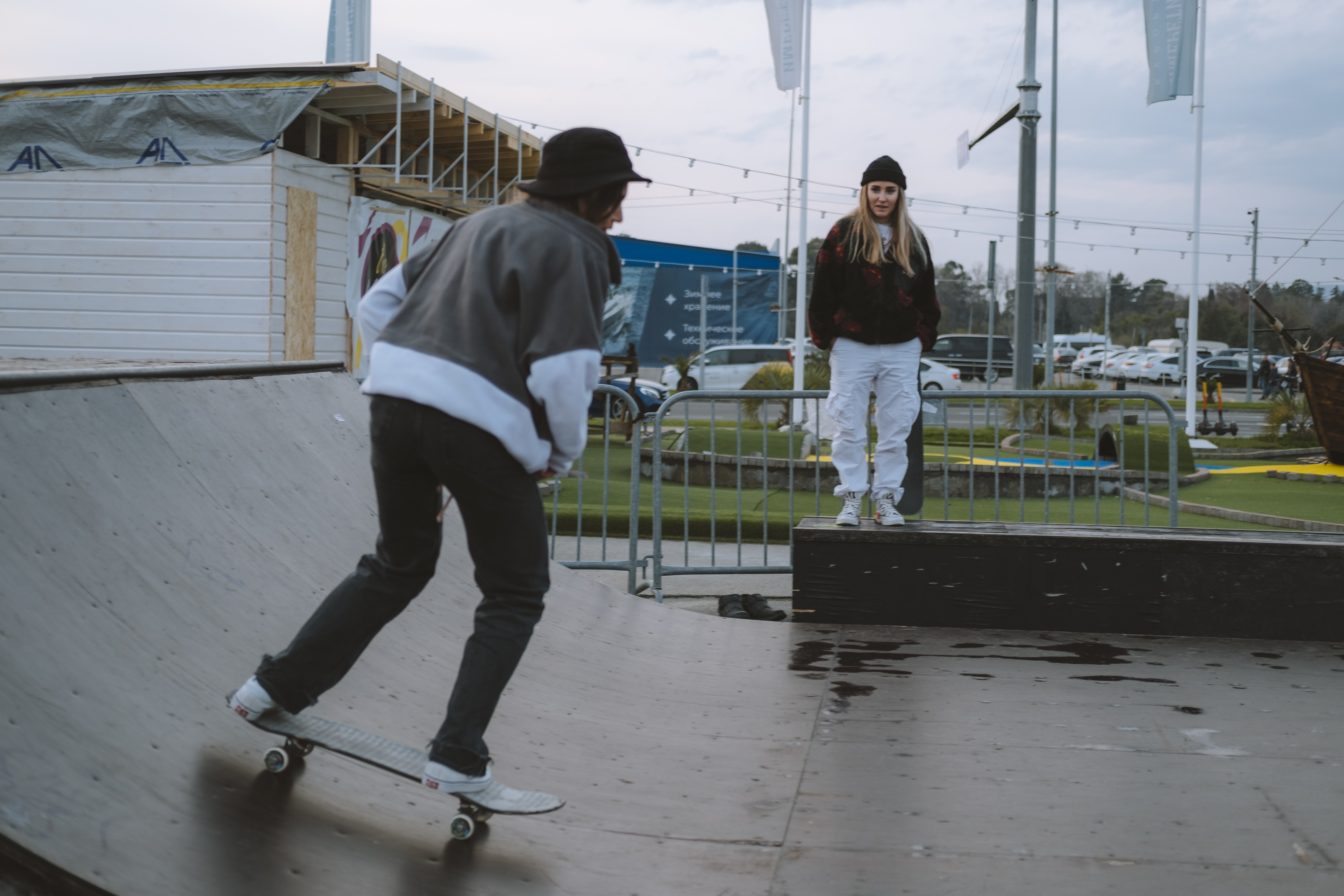 Girl watching other girl skating