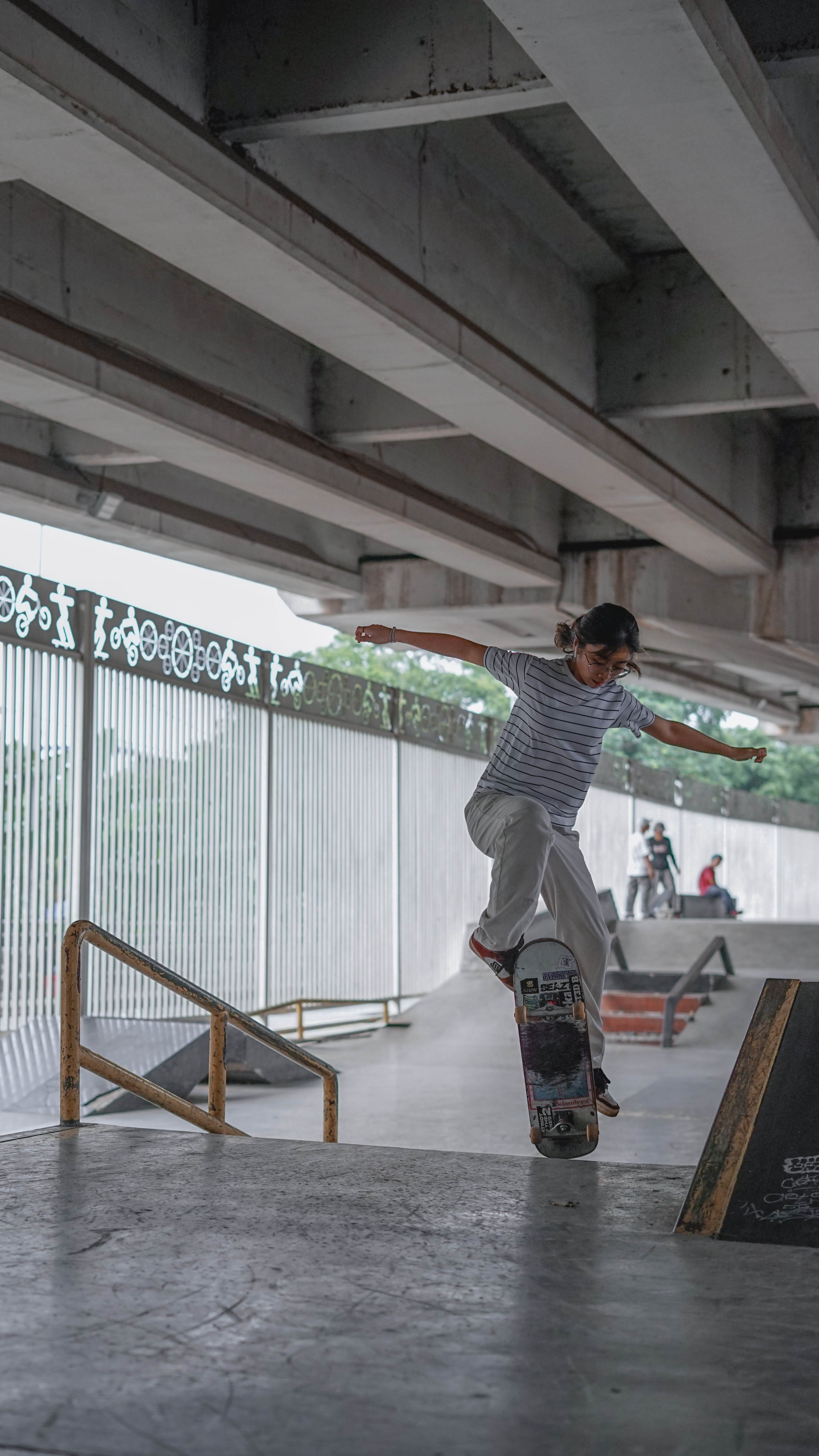 woman doing trick on indoor ramp
